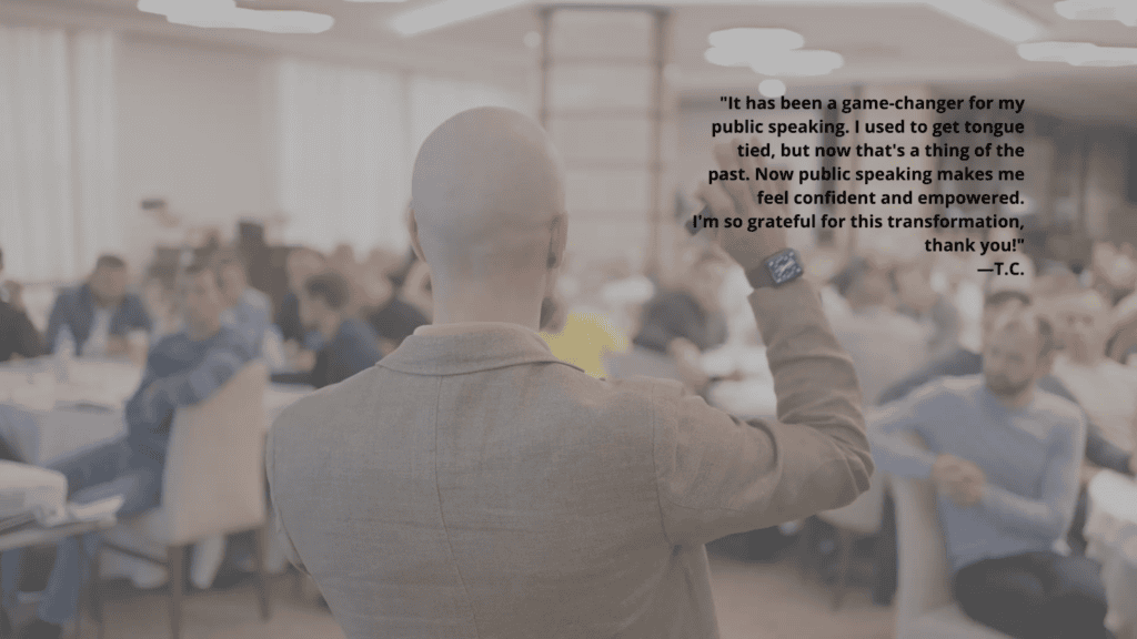 Confident man speaks in front of crowd